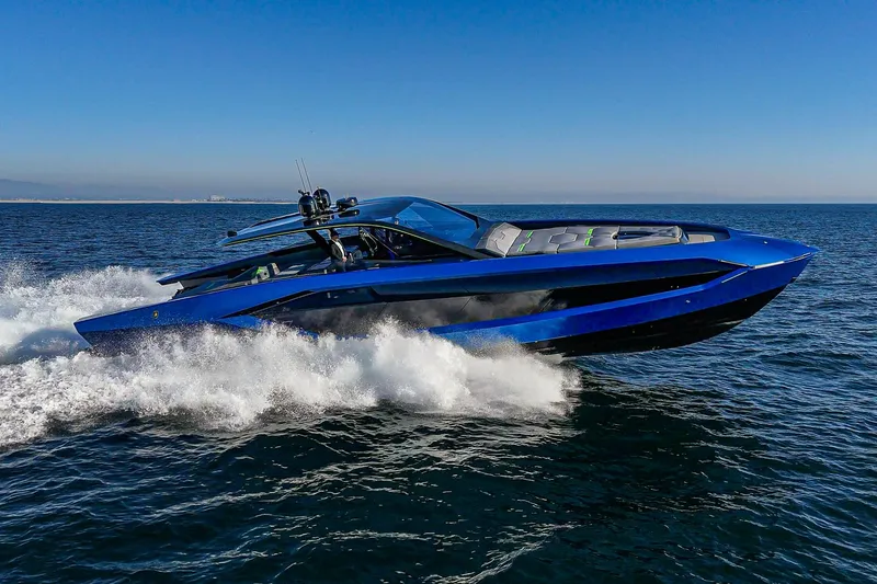 Slide: The Image of 2023 Tecnomar Lamborghini 63 yacht cruising on open water, showcasing sleek design and speed. - 14
