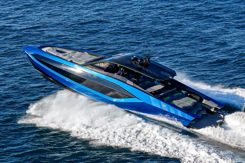 Slide: The Image of 2023 Tecnomar Lamborghini 63 yacht speeding on open water, showcasing sleek design and luxury. - 16