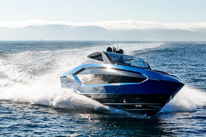Slide: The Image of 2023 Tecnomar Lamborghini 63 yacht cruising on open water, showcasing sleek design and speed. - 17
