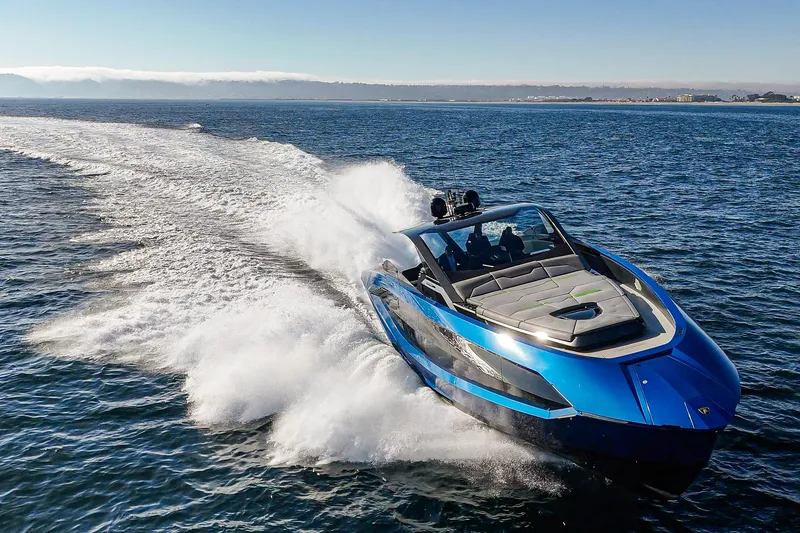 Slide: The Image of 2023 Tecnomar Lamborghini 63 yacht speeding on open water, showcasing sleek design and luxury. - 18