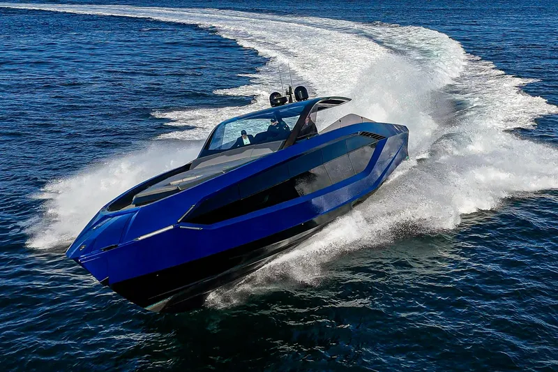 Slide: The Image of 2023 Tecnomar Lamborghini 63 yacht cruising on open water, showcasing sleek design and speed. - 19