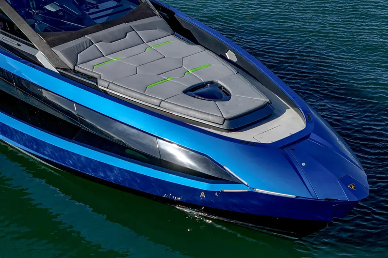 Slide: The Image of 2023 Tecnomar Lamborghini 63 yacht with sleek blue design on water. - 22