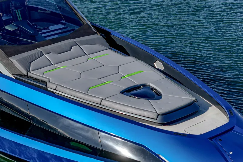 Slide: The Image of 2023 Tecnomar Lamborghini 63 yacht with sleek design and luxurious sunbathing area. - 23