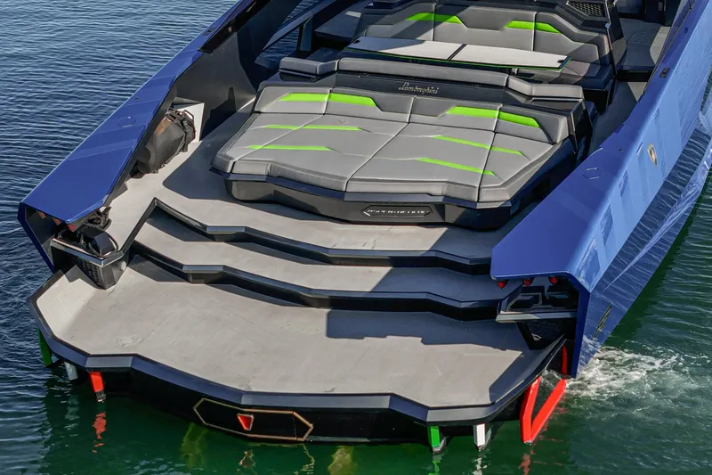 Slide: The Image of 2023 Tecnomar Lamborghini 63 yacht with sleek design and luxurious seating on water. - 27