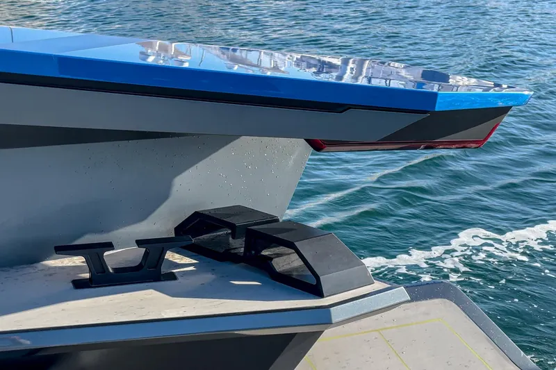 Slide: The Image of 2023 Tecnomar Lamborghini 63 yacht detail with sleek design on water. - 29