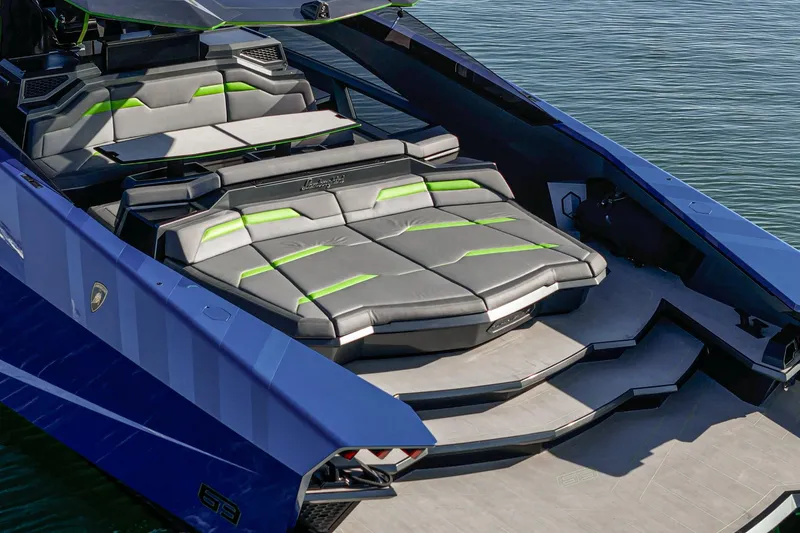 Slide: The Image of Luxury Tecnomar Lamborghini 63 yacht interior with sleek seating, 2023 model, on calm water. - 30