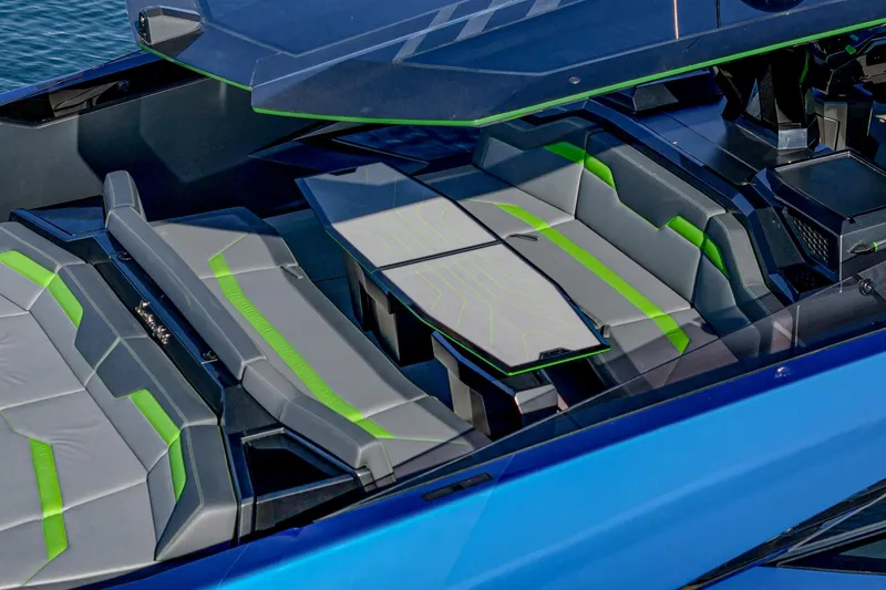 Slide: The Image of 2023 Tecnomar Lamborghini 63 yacht interior with sleek gray and green seating. - 34