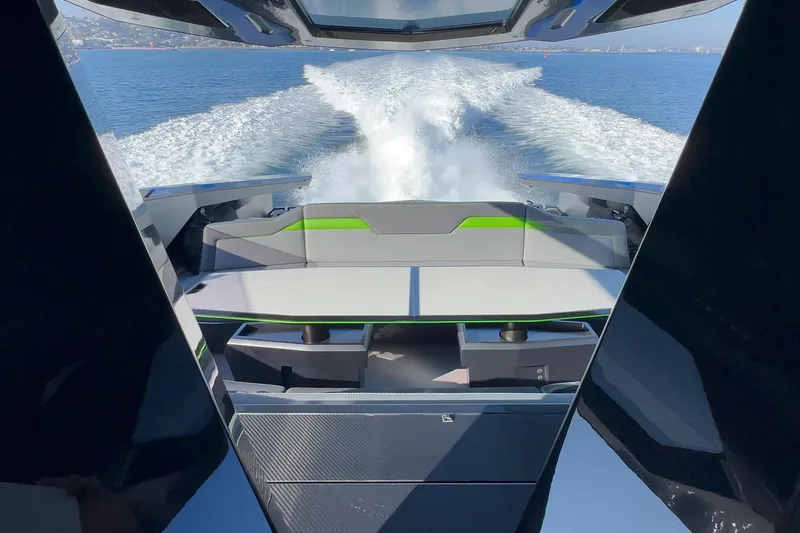 Slide: The Image of 2023 Tecnomar Lamborghini 63 yacht cruising on open water, rear view with wake. - 37