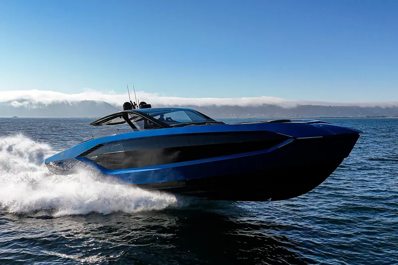 Slide: The Image of 2023 Tecnomar Lamborghini 63 yacht cruising on open water, showcasing sleek design and speed. - 4