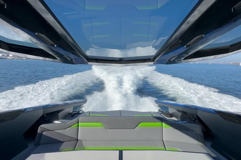 Slide: The Image of 2023 Tecnomar Lamborghini 63 yacht cruising on open water, showcasing sleek design and powerful wake. - 40