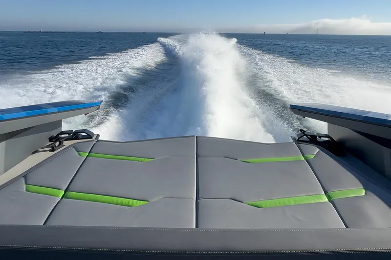 Slide: The Image of 2023 Tecnomar Lamborghini 63 yacht cruising on open water, leaving a foamy wake. - 41