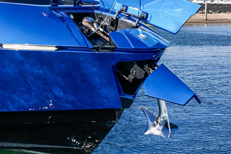 Slide: The Image of Blue Tecnomar Lamborghini 63 yacht with anchor, 2023 model, docked on calm water. - 42