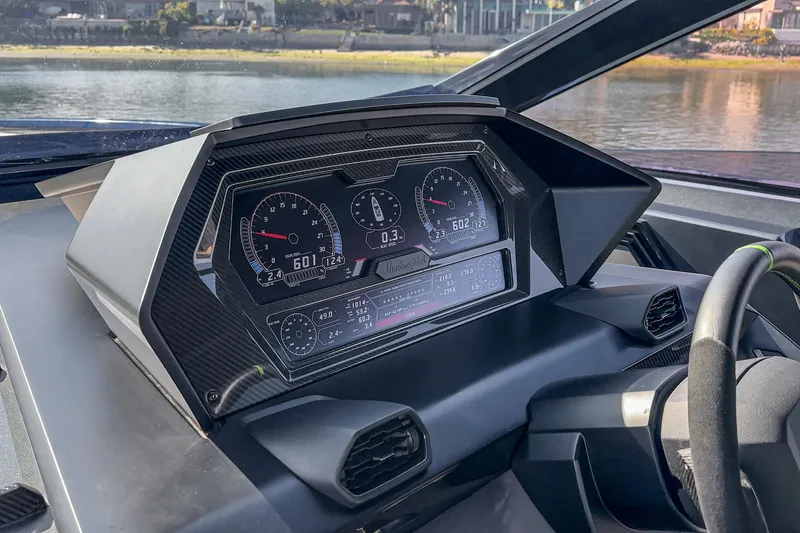 Slide: The Image of Dashboard of 2023 Tecnomar Lamborghini 63 yacht with digital gauges and carbon fiber accents. - 47