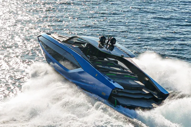 Slide: The Image of 2023 Tecnomar Lamborghini 63 yacht cruising on open water, showcasing sleek design and luxury. - 8