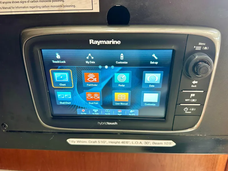 Slide: The Image of Raymarine hybridtouch display on 1988 C&C MKII sailboat, showing navigation and data options. - 13