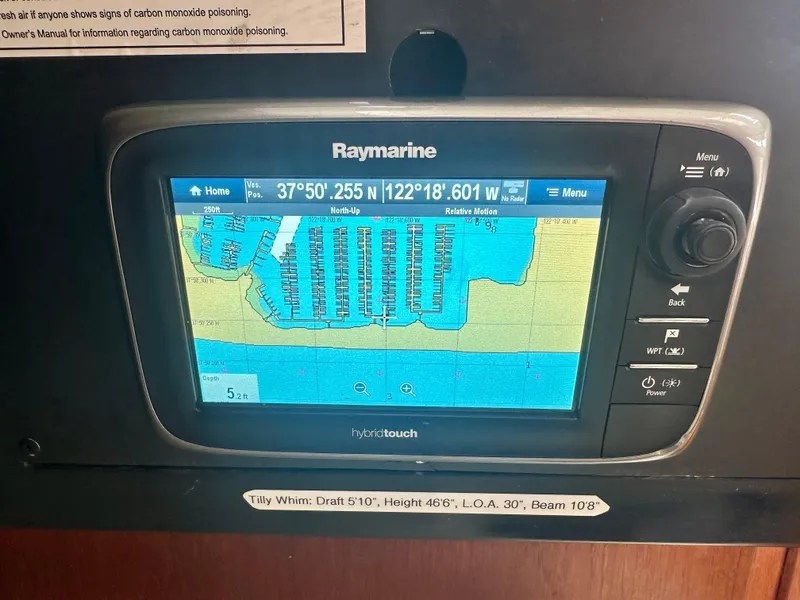 Slide: The Image of Raymarine GPS display on 1988 C&C MKII sailboat, showing marina map coordinates. - 14