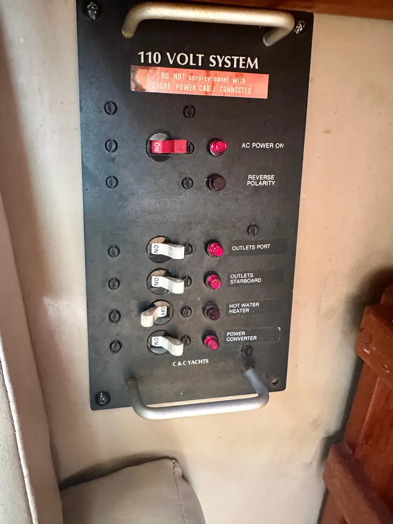 Slide: The Image of Electrical panel of a 1988 C&C MKII boat, featuring 110-volt system controls. - 18
