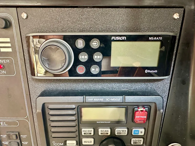 Slide: The Image of Control panel of a 1988 C&C MKII with Fusion MS-RA70 and Icom IC-M502 devices. - 19