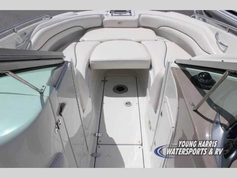 Slide: The Image of 2005 Crownline 240EX boat interior with white seating and deck, Young Harris Watersports logo. - 11
