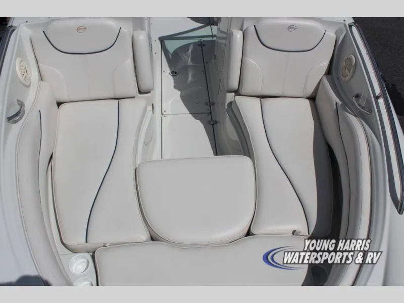 Slide: The Image of 2005 Crownline 240EX boat interior with white cushioned seating. - 13