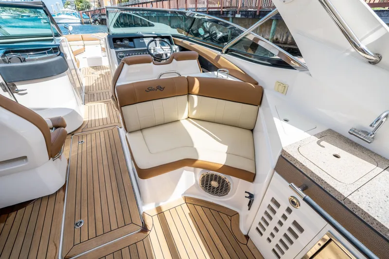 Slide: The Image of 2015 Sea Ray 350 SLX boat interior with luxurious seating and teak flooring. - 19