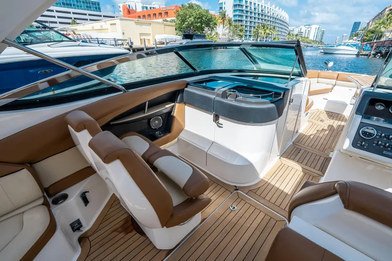 Slide: The Image of Luxurious 2015 Sea Ray 350 SLX boat interior with elegant seating and modern dashboard. - 27