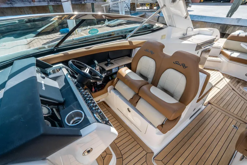 Slide: The Image of 2015 Sea Ray 350 SLX boat interior with leather seats and modern dashboard. - 29