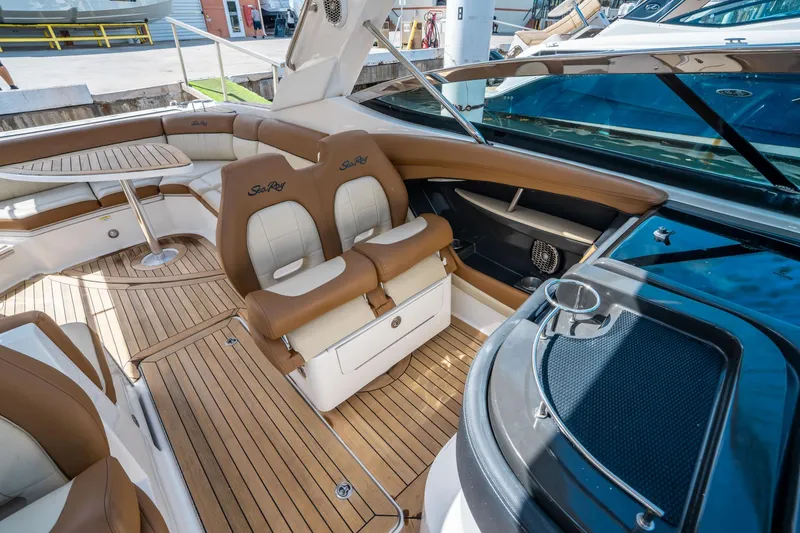 Slide: The Image of Luxurious 2015 Sea Ray 350 SLX boat interior with teak flooring and plush seating. - 30
