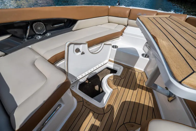 Slide: The Image of Luxurious 2015 Sea Ray 350 SLX boat interior with cushioned seating and wooden flooring. - 40