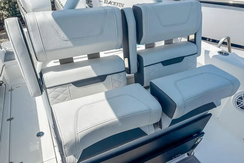 Slide: The Image of 2023 Blackfin 302CC boat seating with modern design and comfortable upholstery. - 13