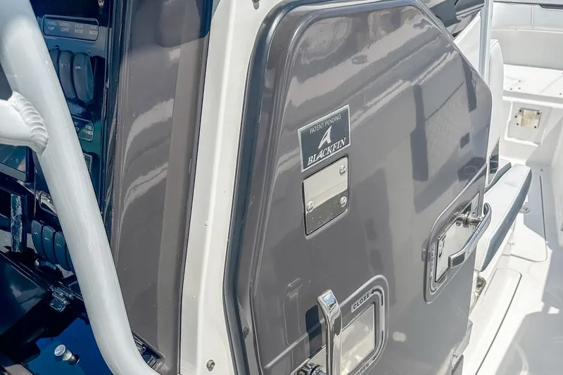 Slide: The Image of 2023 Blackfin 302CC boat console with control panel and patent pending label. - 16