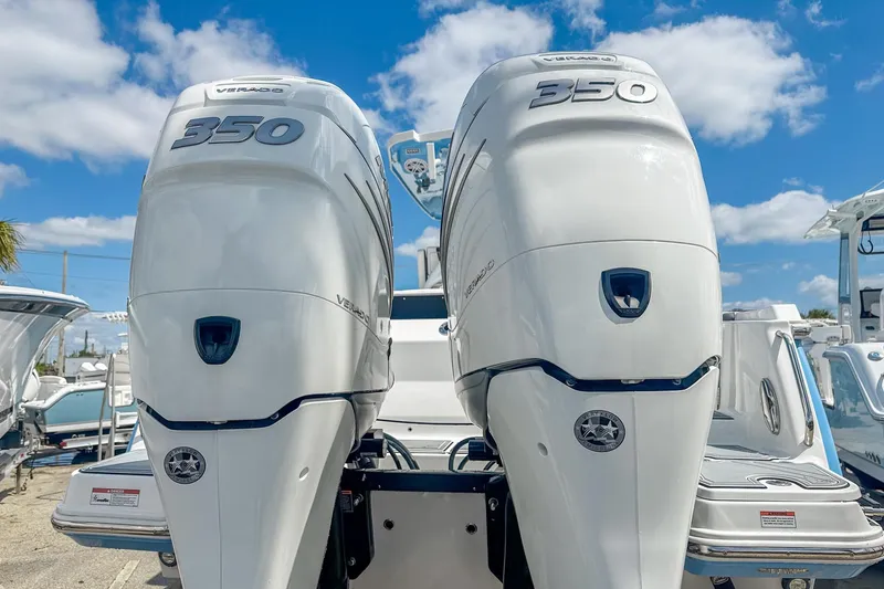 Slide: The Image of Twin 350 Verado engines on a 2023 Blackfin 302CC boat under a clear sky. - 4