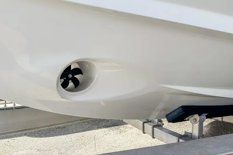 Slide: The Image of Close-up of 2023 Blackfin 302CC boat hull with visible propeller. - 8