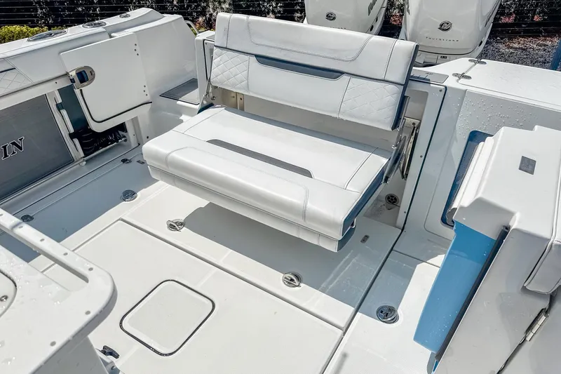 Slide: The Image of 2023 Blackfin 302CC boat interior with foldable seating and modern design. - 9