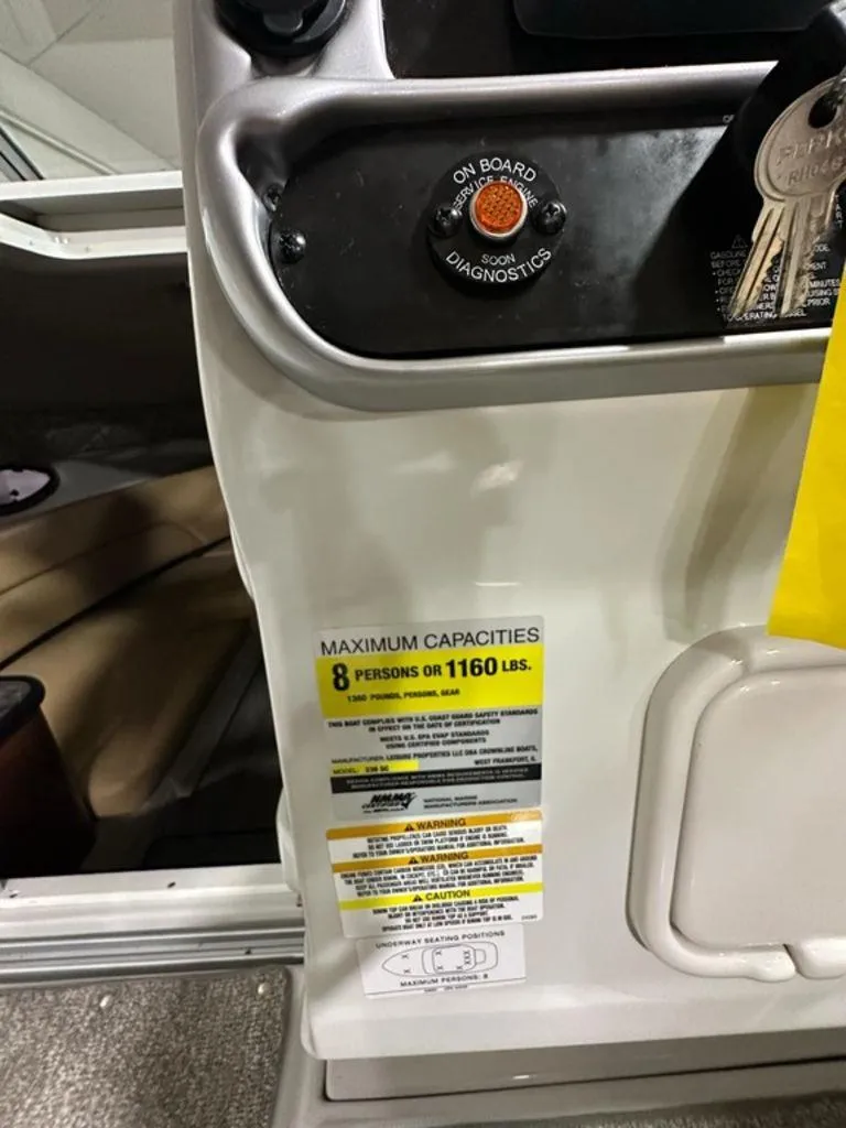 Slide: The Image of 2015 Crownline 236 SC boat capacity label, maximum 8 persons or 1160 lbs. - 19