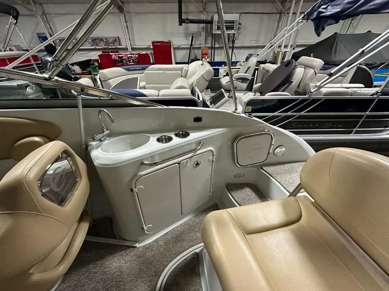Slide: The Image of Interior of a 2015 Crownline 236 SC boat with seating and sink area. - 21