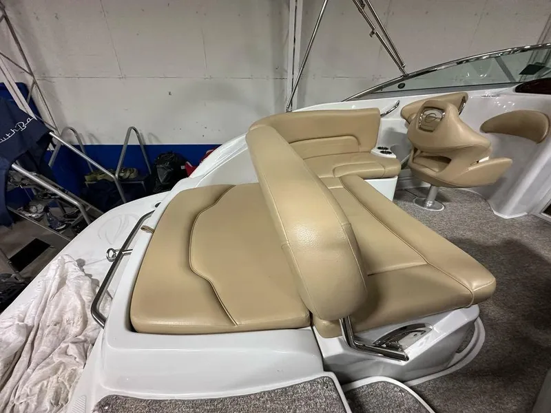 Slide: The Image of 2015 Crownline 236 SC boat interior with beige seating and modern design. - 23