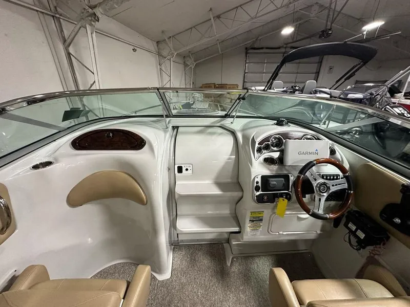 Slide: The Image of Interior view of 2015 Crownline 236 SC boat with Garmin navigation system. - 7