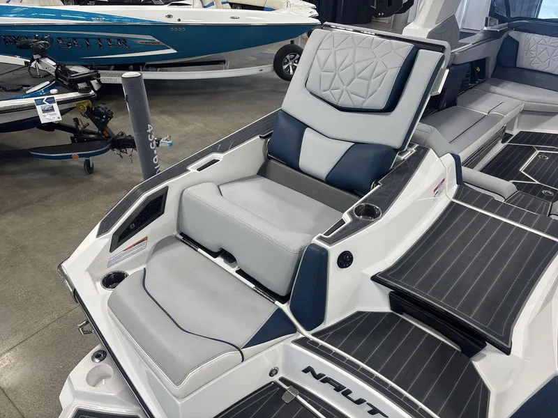 Slide: The Image of 2022 Nautique G25 Paragon boat interior with luxurious seating and modern design. - 12