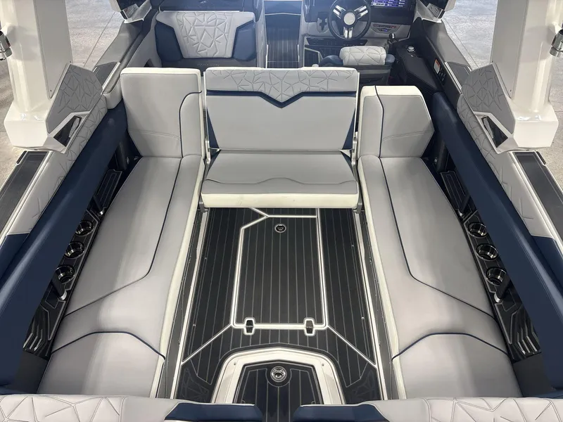 Slide: The Image of 2022 Nautique G25 Paragon interior with luxurious seating and modern design. - 14