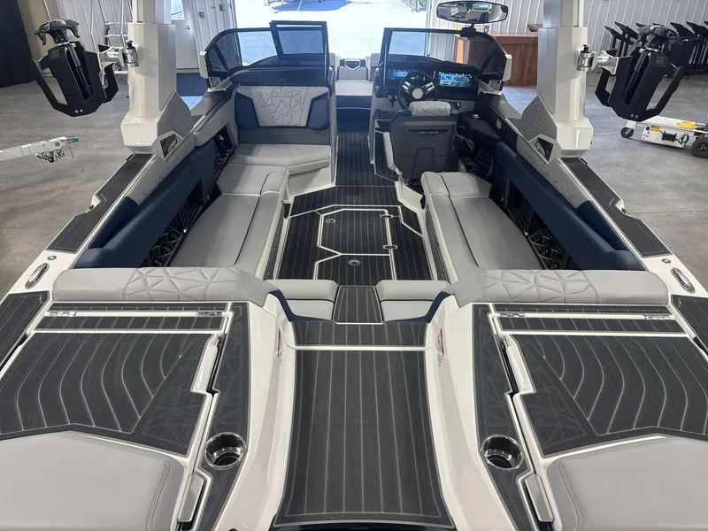 Slide: The Image of 2022 Nautique G25 Paragon interior with luxurious seating and advanced dashboard features. - 5