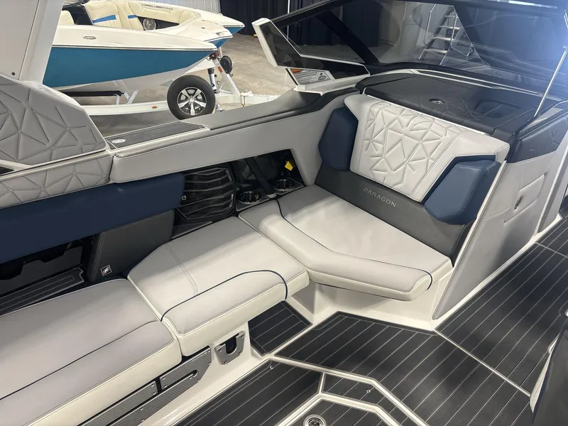 Slide: The Image of 2022 Nautique G25 Paragon interior with luxurious seating and modern design. - 8