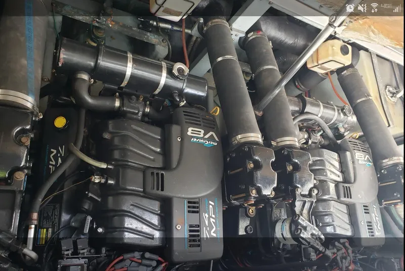 Slide: The Image of Engine compartment of a 1999 Sea Ray 330 Sundancer with V8 engines. - 16