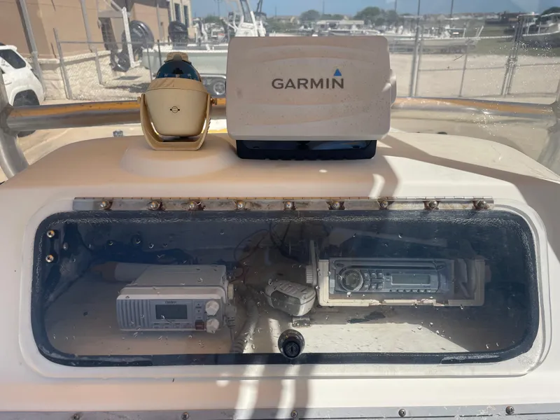 Slide: The Image of Dashboard of a 2003 Baystealth 2230 boat with Garmin navigation equipment. - 13