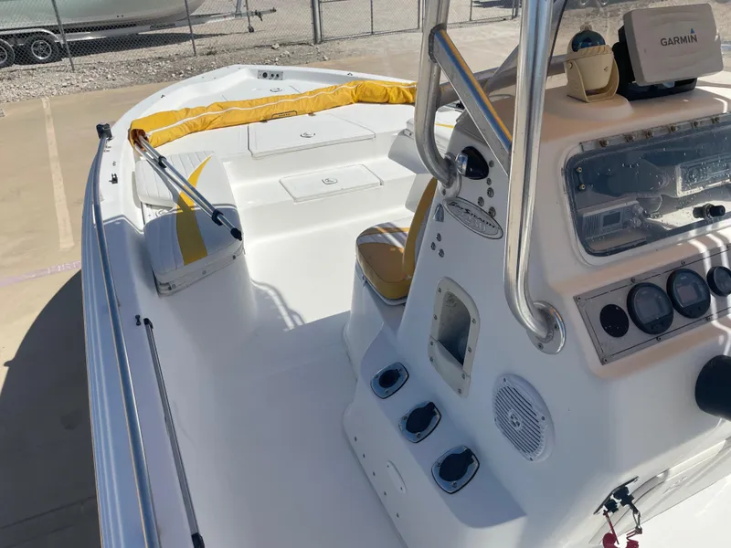 Slide: The Image of 2003 Baystealth 2230 boat interior with Garmin navigation system and yellow seating. - 15