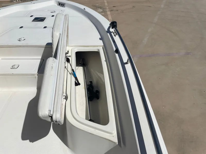 Slide: The Image of 2003 Baystealth 2230 boat deck with open storage compartment. - 26