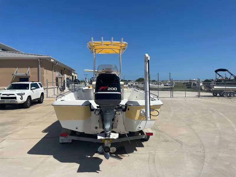 Slide: The Image of 2003 Baystealth 2230 boat with Yamaha 200 engine, parked outdoors on a sunny day. - 6