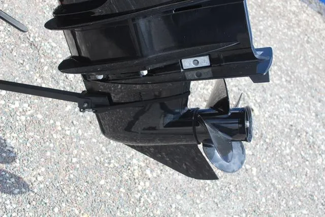 Slide: The Image of 2019 Tracker Pro Guide™ V-165 WT boat motor propeller on gravel surface. - 12