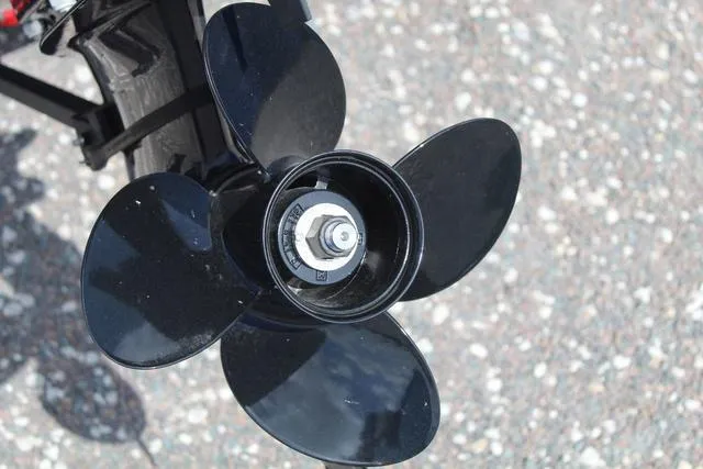 Slide: The Image of Close-up of a black propeller on a 2019 Tracker Pro Guide™ V-165 WT boat. - 13