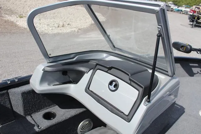 Slide: The Image of 2019 Tracker Pro Guide™ V-165 WT boat dashboard with open windshield and storage compartment. - 21